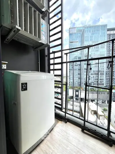 Modern balcony with washing machine and city view, perfect for urban living.
