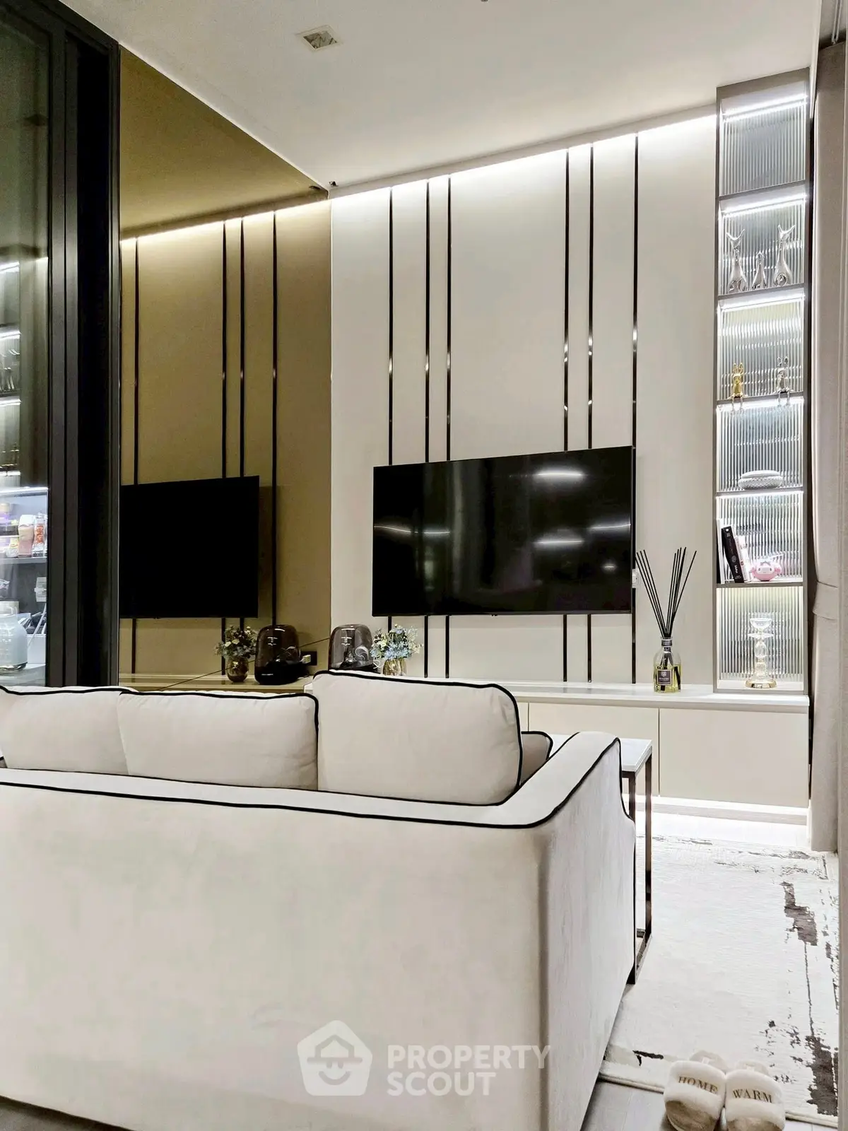 Luxurious modern living room with sleek TV setup and elegant decor