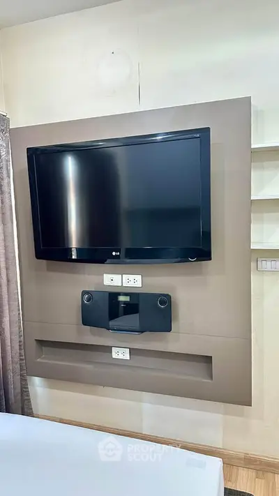 Modern living room with wall-mounted TV and sleek design