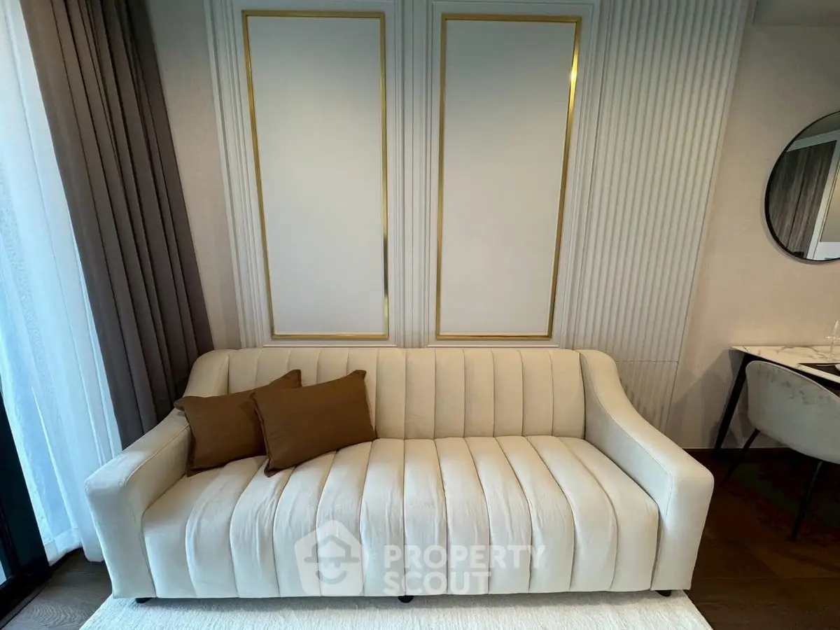 Elegant living room with plush beige sofa and modern decor