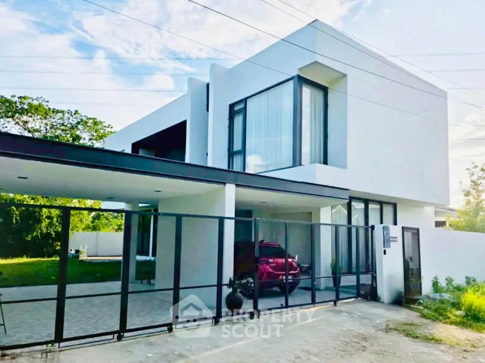 Modern minimalist two-story house with sleek design and spacious driveway