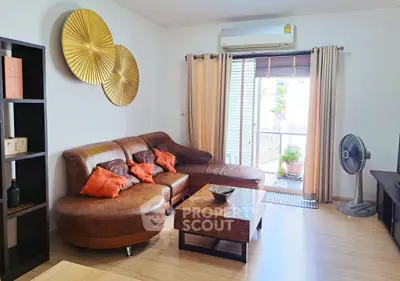 Stylish living room with leather sofa and modern decor in bright apartment