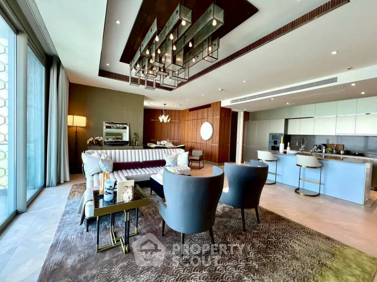 Luxurious open-plan living room with modern kitchen and elegant decor