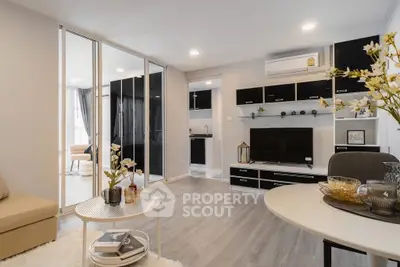 Modern living room with open layout and stylish decor in a contemporary apartment.