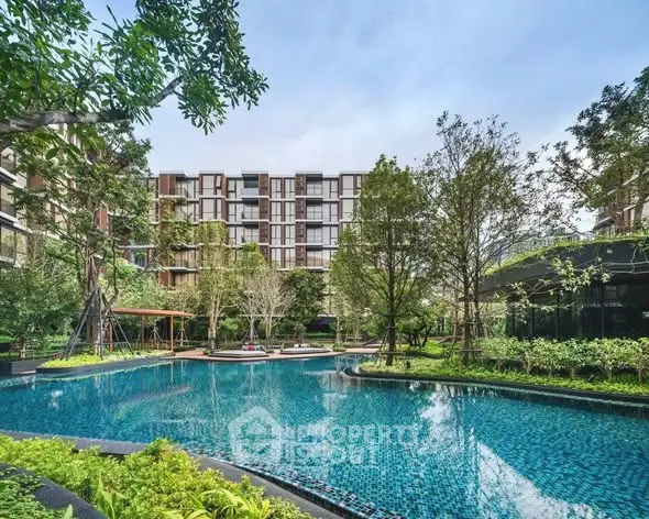 Luxurious residential complex with stunning pool and lush greenery