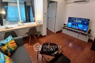 Cozy living room with modern decor and entertainment setup, perfect for relaxation and leisure.