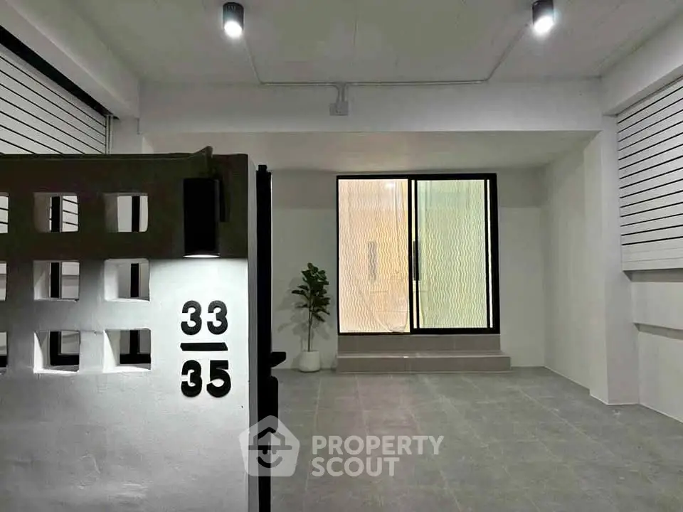 Modern minimalist entrance with sleek design and ambient lighting