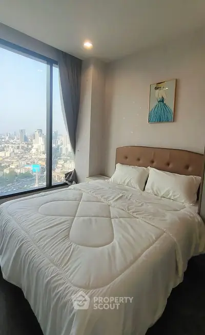 Luxurious bedroom with stunning city view and elegant decor
