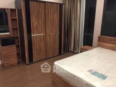 Modern bedroom with wooden furniture and large wardrobe