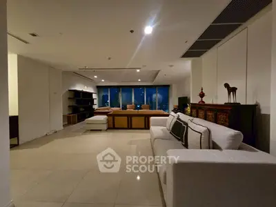 Spacious modern living room with elegant decor and city view