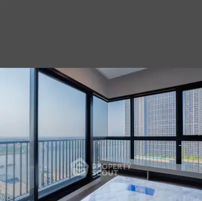 Stunning corner unit with panoramic city and river views, featuring floor-to-ceiling windows and modern design.