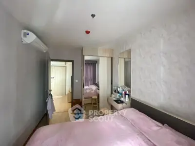 Cozy bedroom with modern decor and ample natural light, featuring a comfortable bed and stylish furnishings.