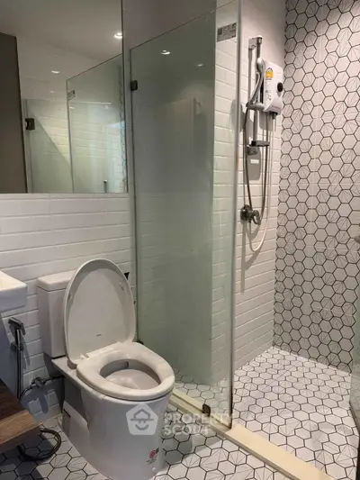 Modern bathroom with glass shower and stylish tile design