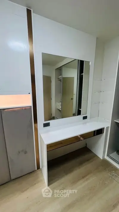 Modern bedroom with stylish vanity and large mirror