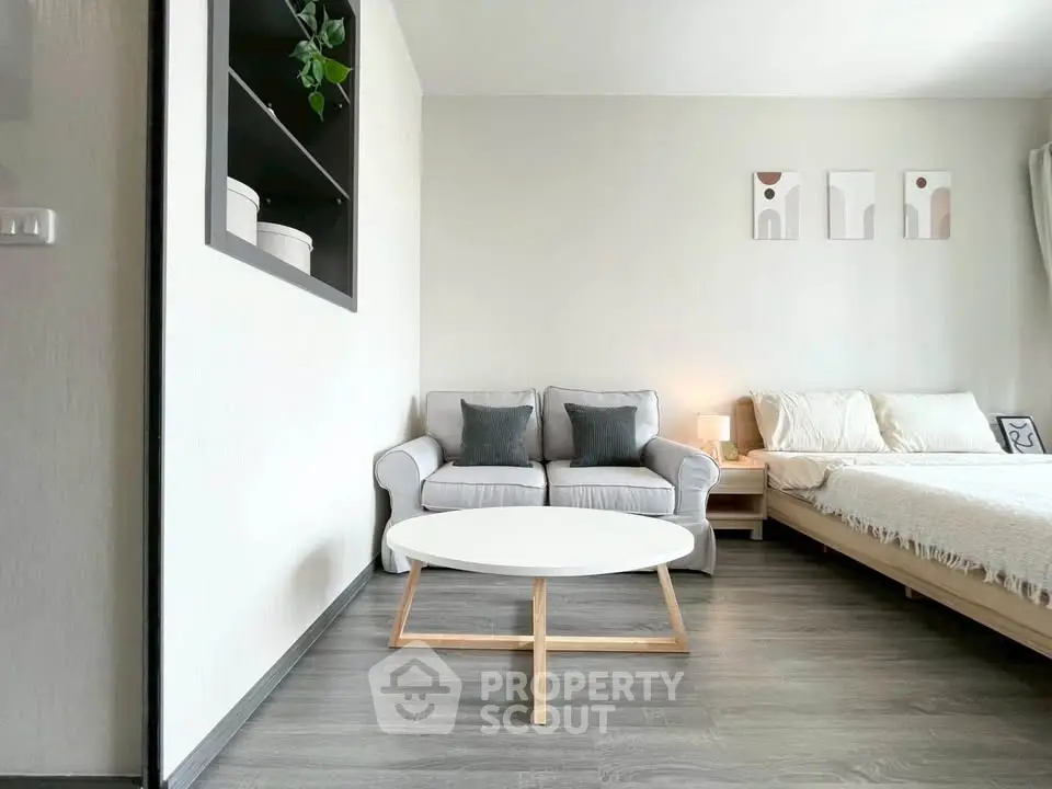 Modern studio apartment with cozy living area and stylish decor