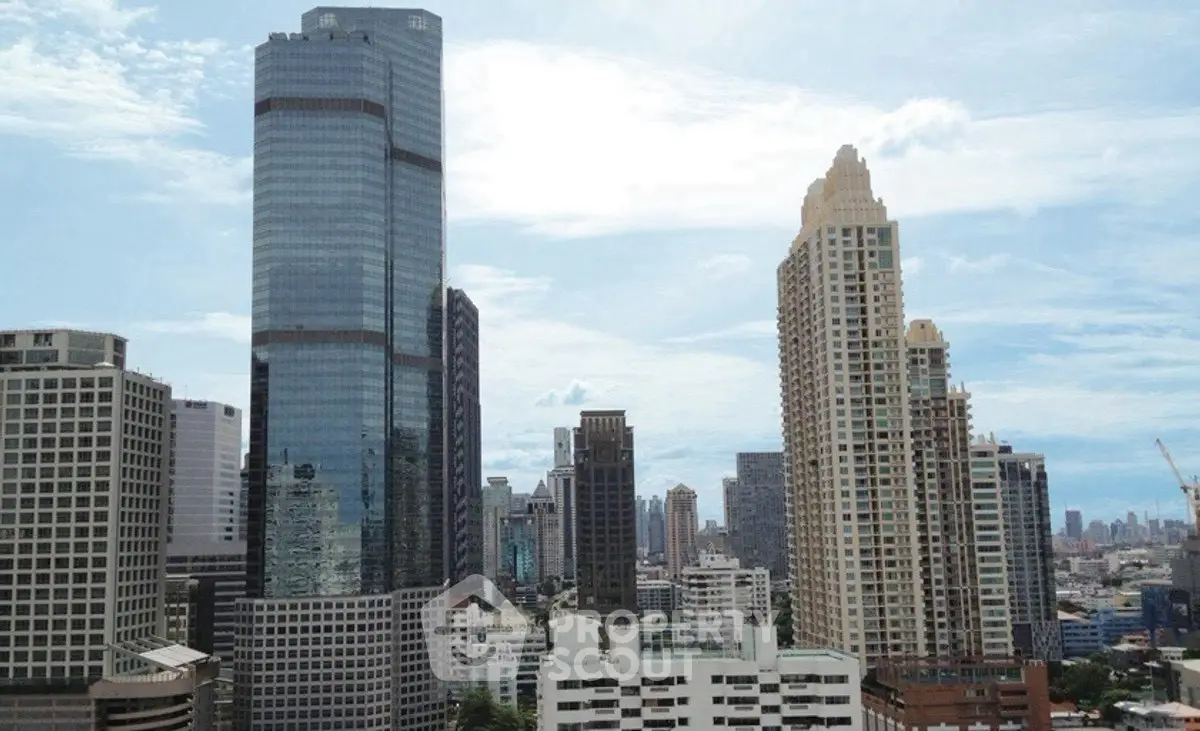 Stunning cityscape view with modern skyscrapers under a clear blue sky.