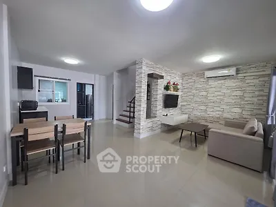 Spacious modern living room with open layout and stylish decor, perfect for family gatherings.