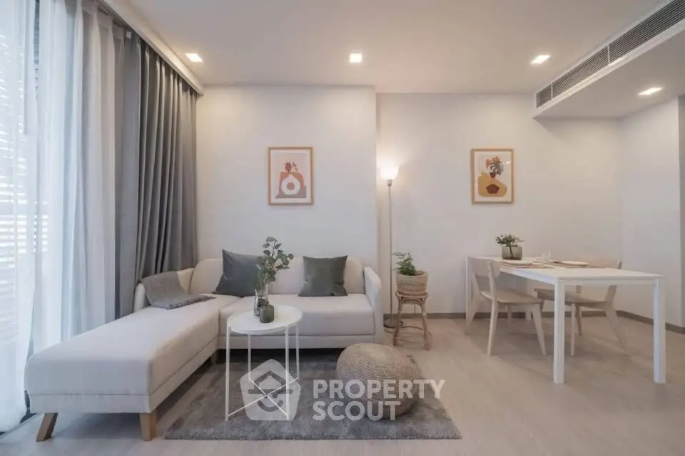 Modern living room with elegant decor and cozy dining area