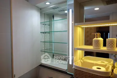 Modern bathroom with illuminated mirror and stylish shelving