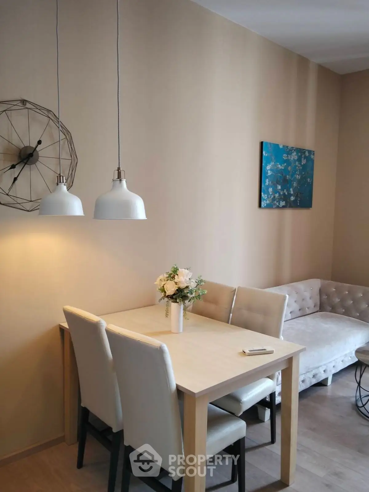Stylish living room with modern decor, cozy seating, and elegant dining area.
