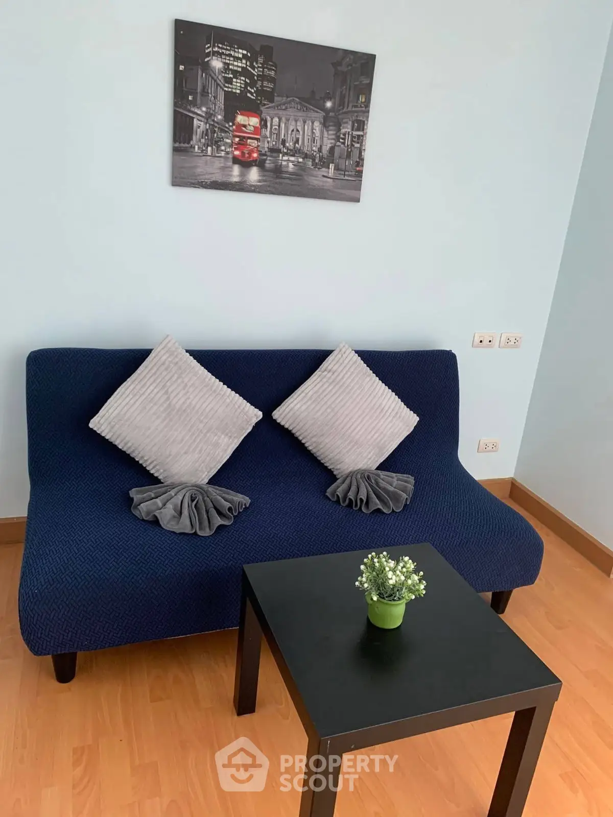 Cozy living room with stylish blue sofa and modern decor