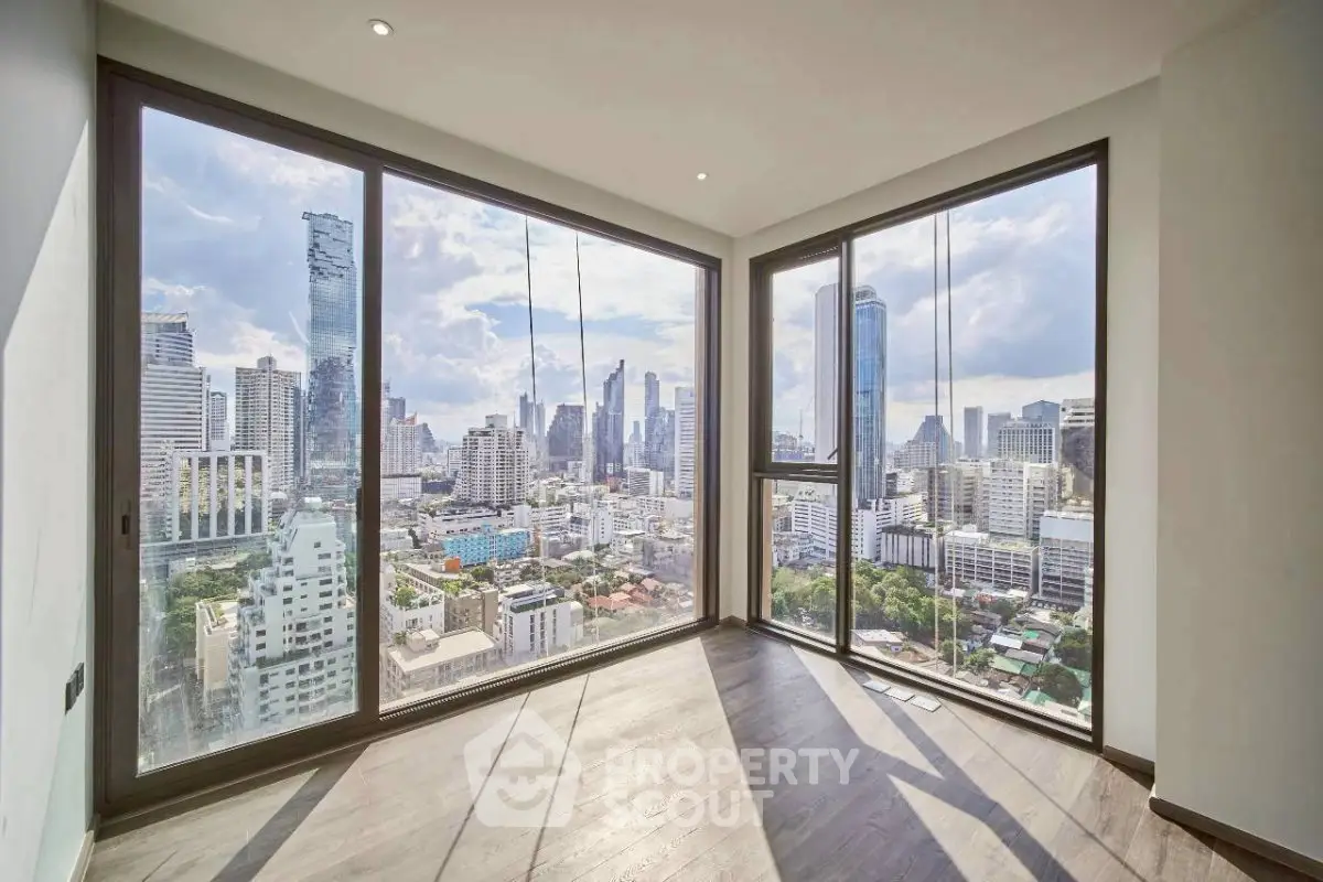 Stunning corner unit with panoramic city views and floor-to-ceiling windows in a modern high-rise.