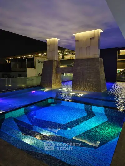 Luxurious indoor pool with modern architectural design and ambient lighting