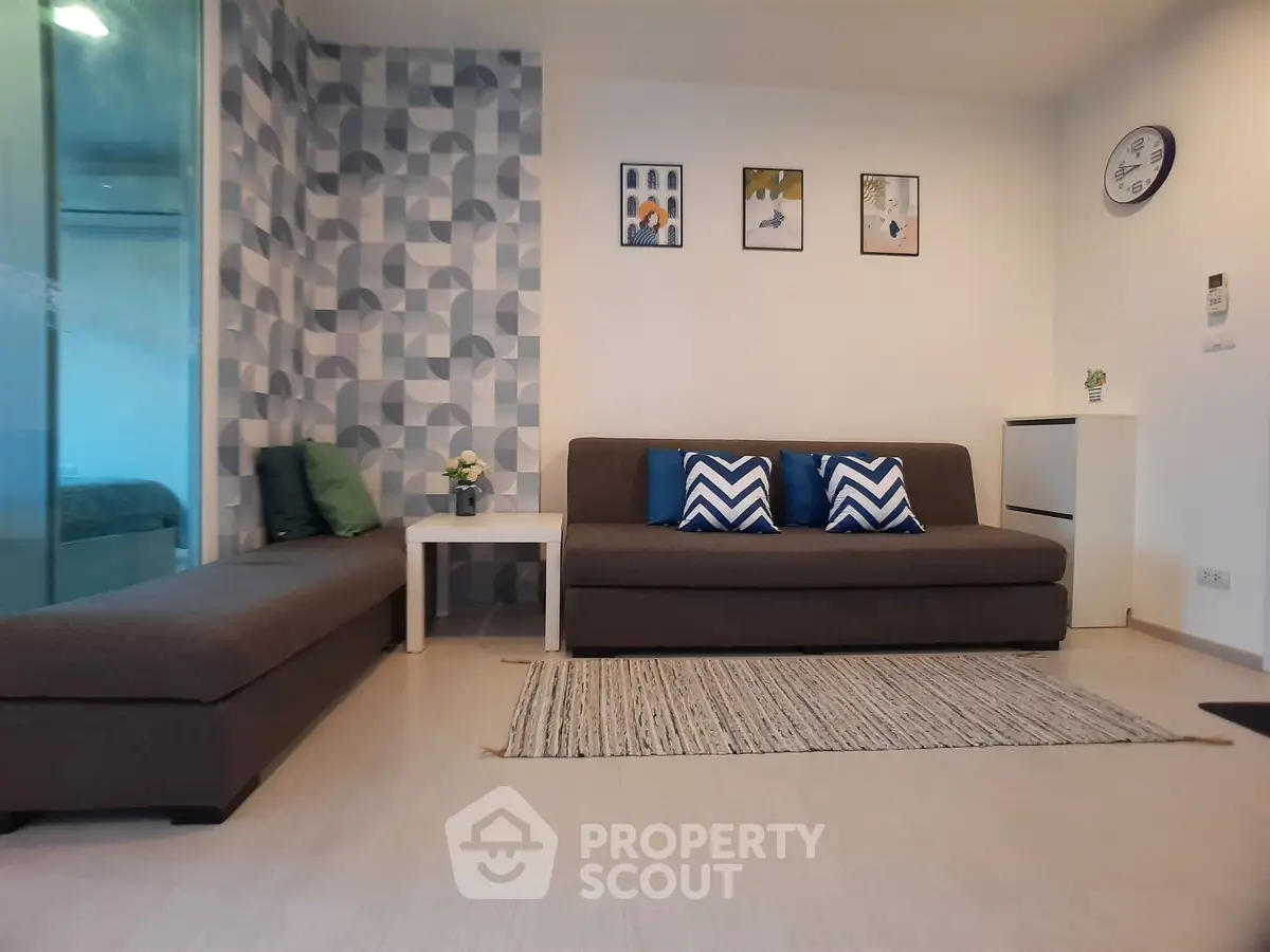 Modern living room with stylish decor and comfortable seating in a contemporary apartment.