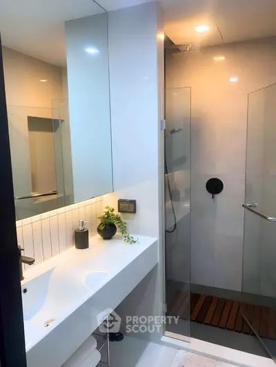 Modern bathroom with sleek design and glass shower enclosure