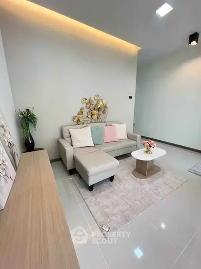 Modern living room with stylish decor and cozy seating area.