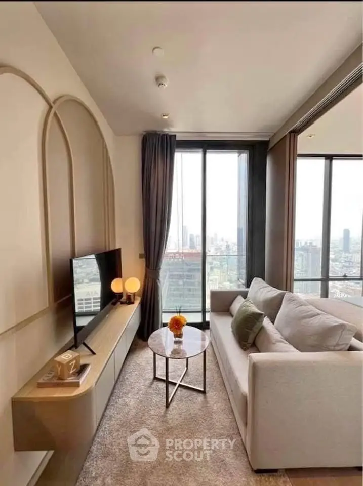 Modern living room with city view, stylish decor, and cozy seating area.