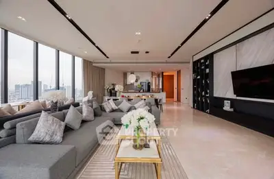 Luxurious modern living room with panoramic city views and elegant decor