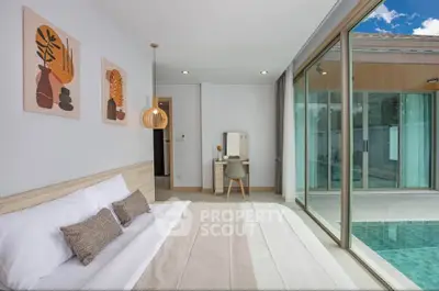 Luxurious bedroom with pool view and modern decor in a stylish home