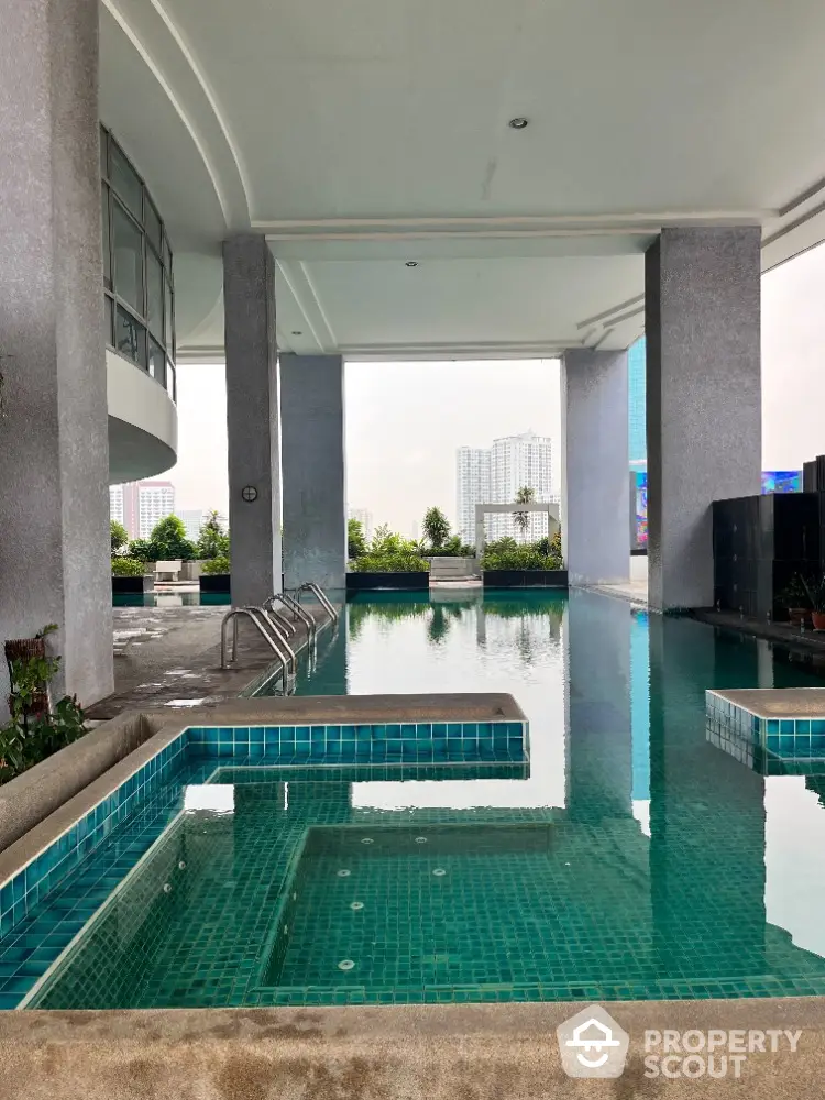 Luxurious high-rise building with stunning pool and city views