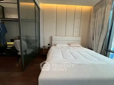 Luxurious bedroom with modern design and elegant lighting, featuring a cozy bed and stylish decor.