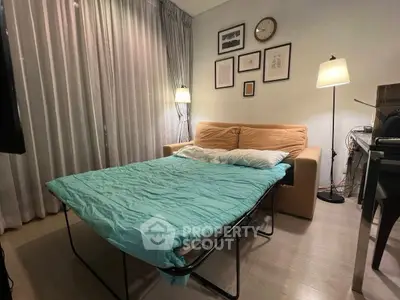 Cozy living room with sofa bed and stylish decor, perfect for modern living.