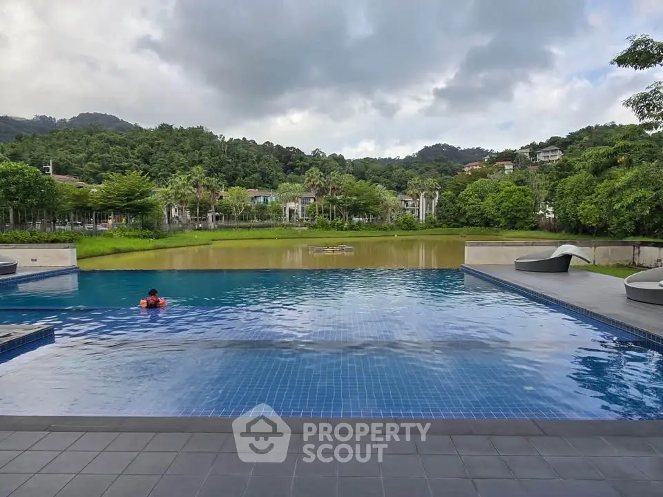 Luxurious infinity pool with scenic mountain and lush greenery views.