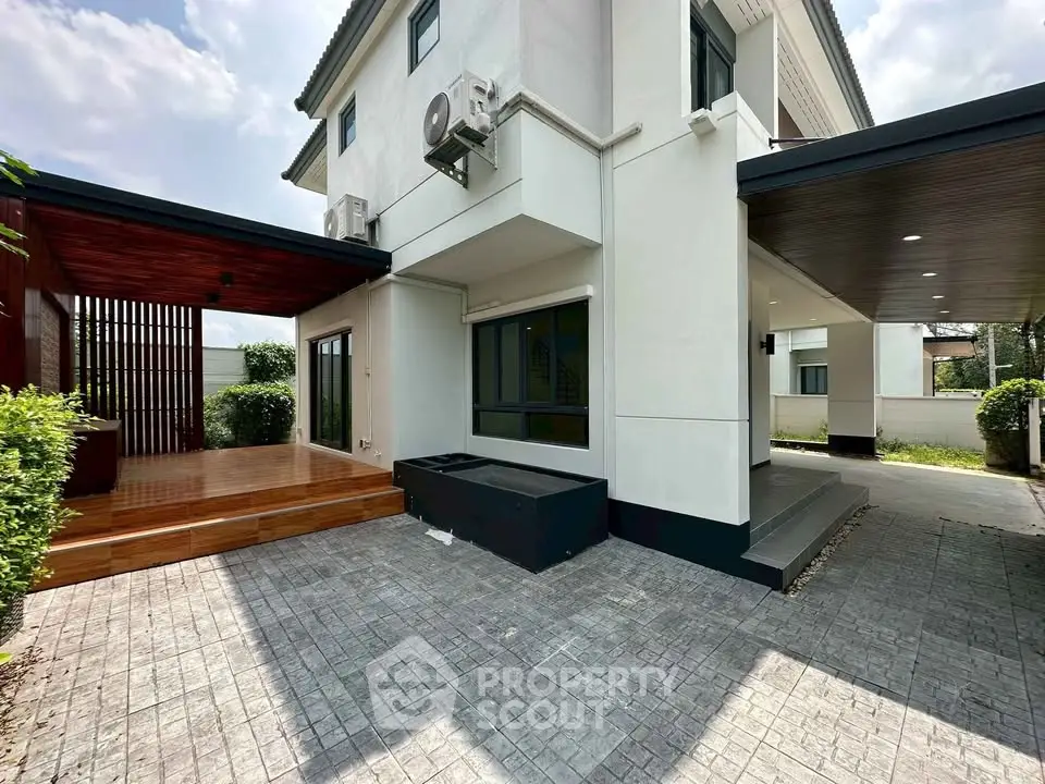 Modern house exterior with spacious patio and sleek design