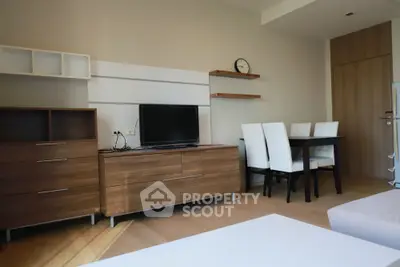 Modern living room with stylish furniture and dining area