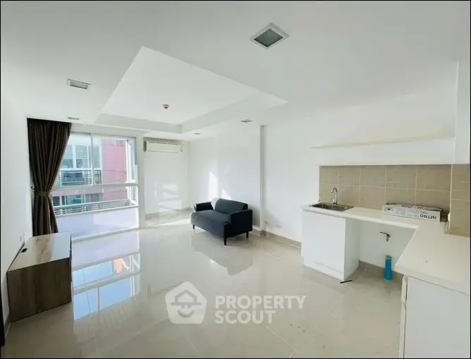 Spacious modern living room with large windows and sleek design