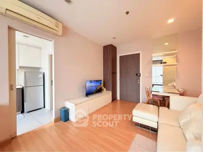 Modern living room with wooden flooring and cozy seating area