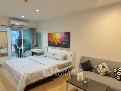 Modern bedroom with stylish decor and balcony access