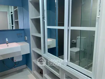 Modern bathroom with glass shower and sleek sink design