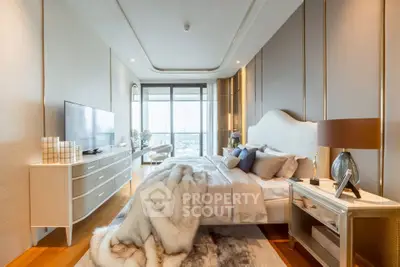 Luxurious bedroom with elegant decor and stunning city view, featuring modern furniture and cozy ambiance.