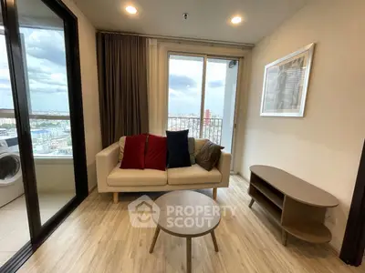 Modern living room with balcony view in high-rise apartment