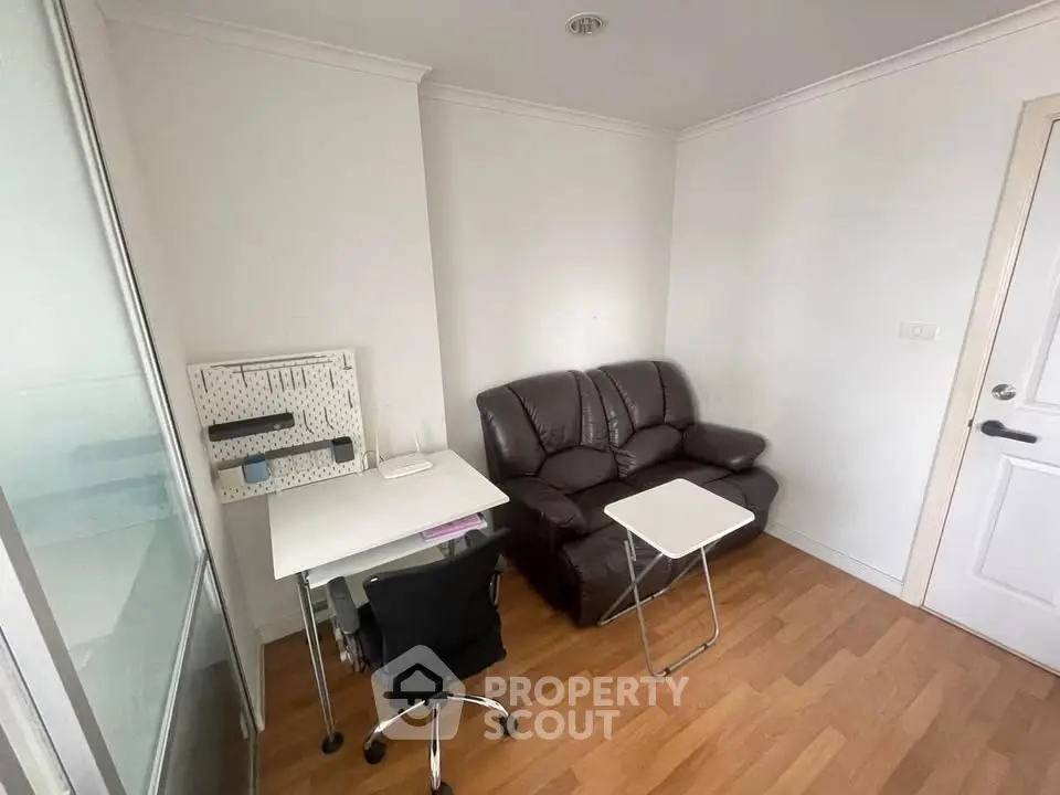 Cozy study room with leather sofa and modern desk setup