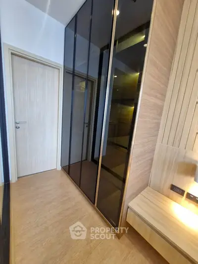 Modern bedroom with sleek built-in wardrobe and wooden accents