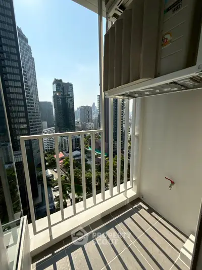 Modern high-rise balcony with cityscape view, perfect for urban living enthusiasts.