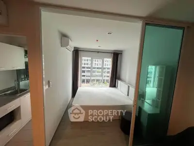 Modern studio apartment with open layout and large window view