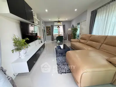 Spacious modern living room with elegant decor and large leather sofa